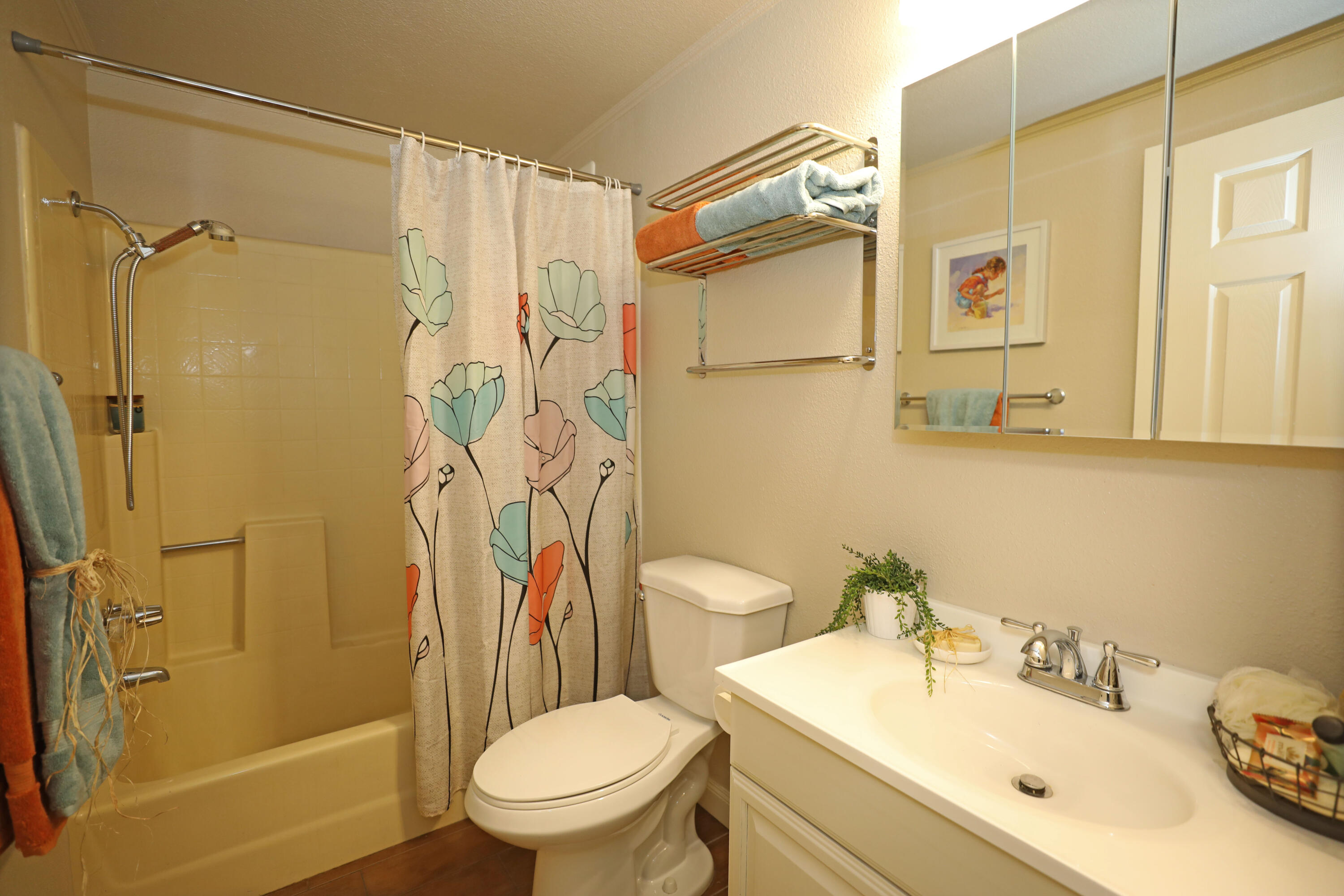 1183 Fox Den Drive Redding, CA 96003 - Photo 8 of 17 a bathroom with a sink toilet and shower
