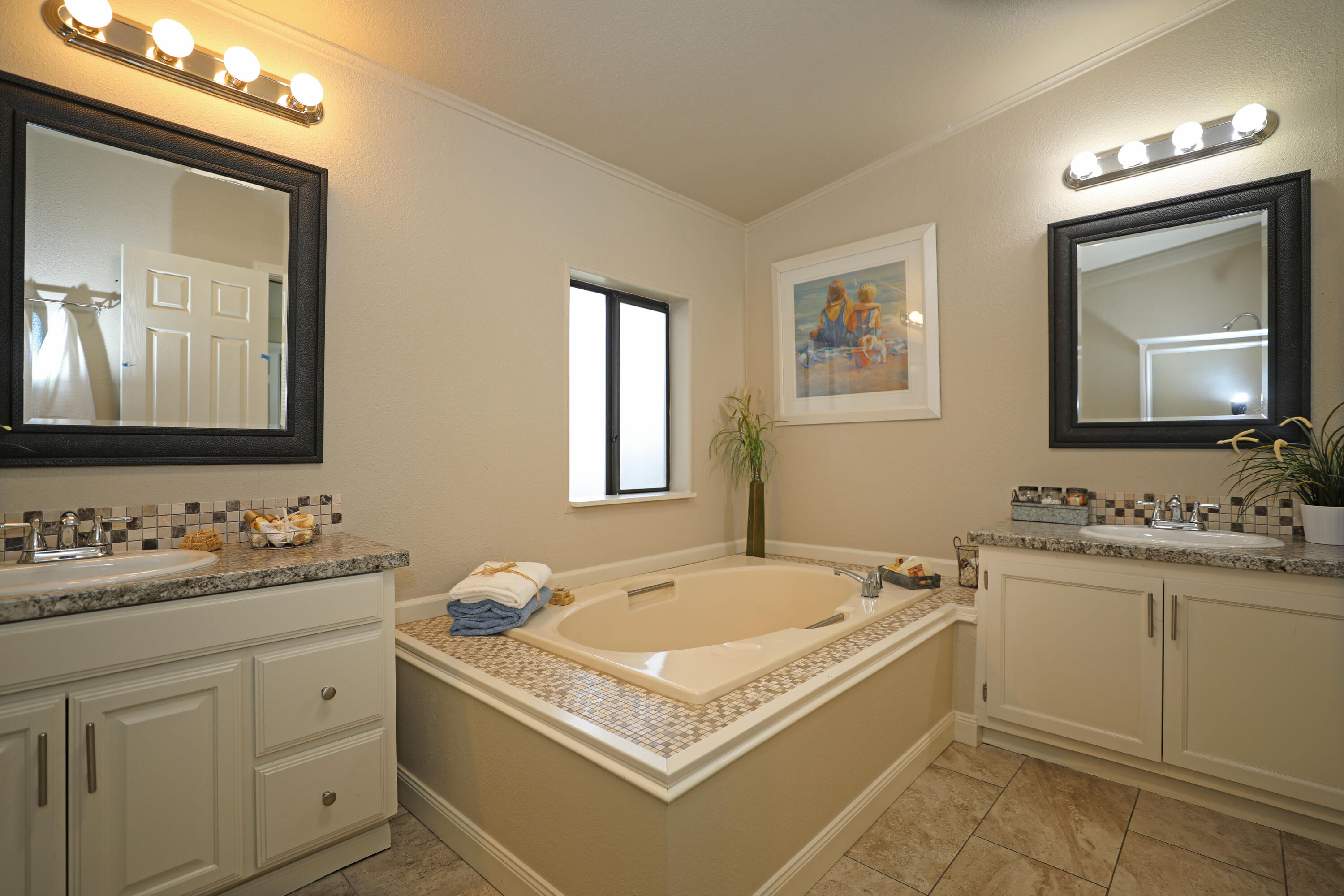 1183 Fox Den Drive Redding, CA 96003 - Photo 10 of 17 a bathroom with a tub sink and mirror