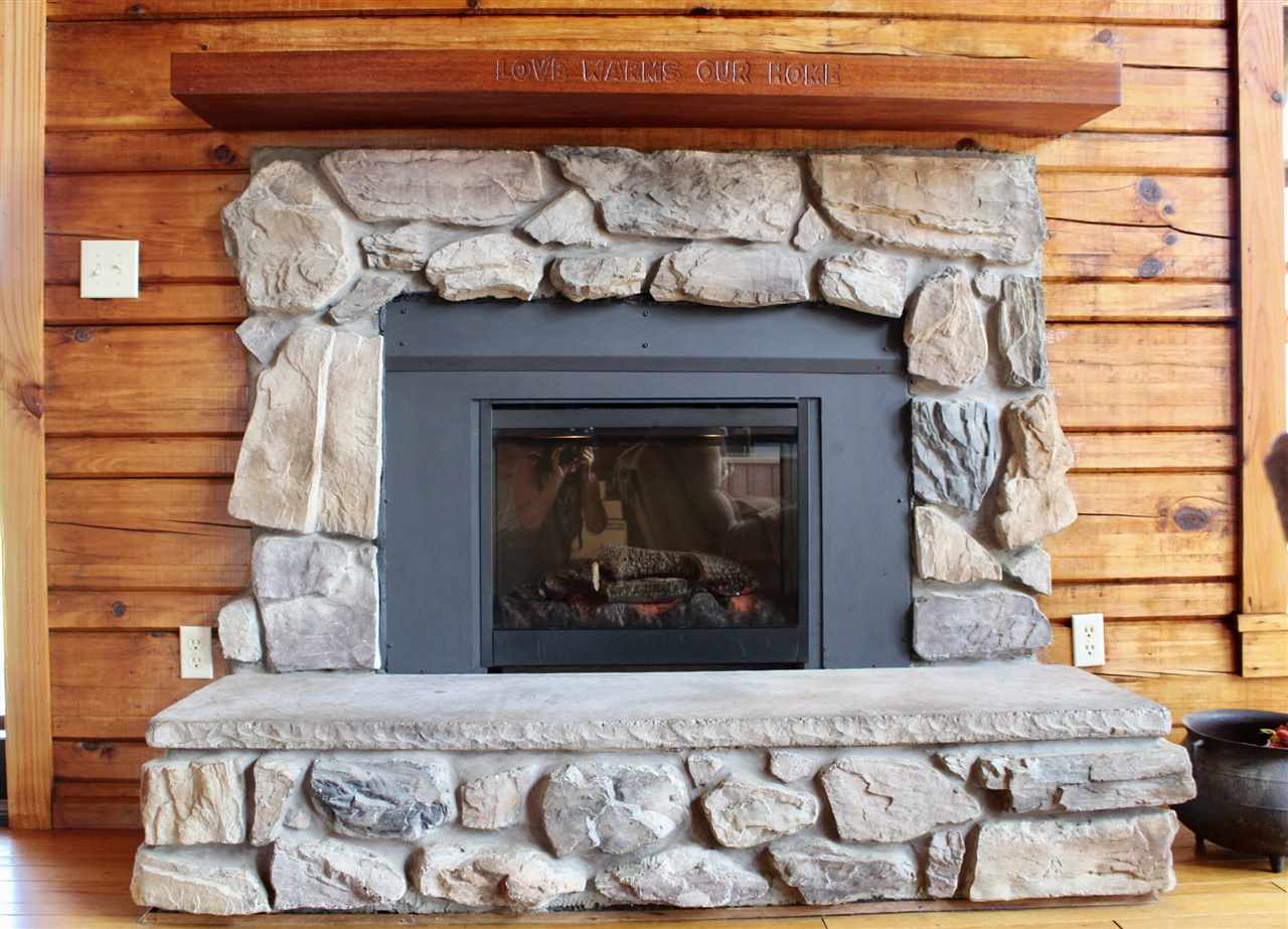 1185 Bunker Hill Road Mount Solon, VA 22843 - Photo 15 of 39 a bedroom with a bed and a fireplace