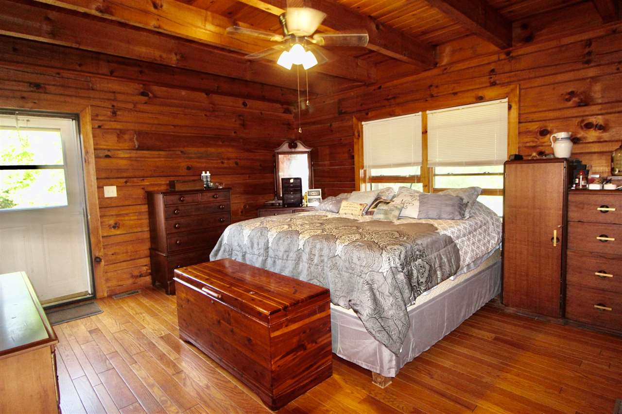 1185 Bunker Hill Road Mount Solon, VA 22843 - Photo 17 of 39 a bed sitting in a bedroom next to a window