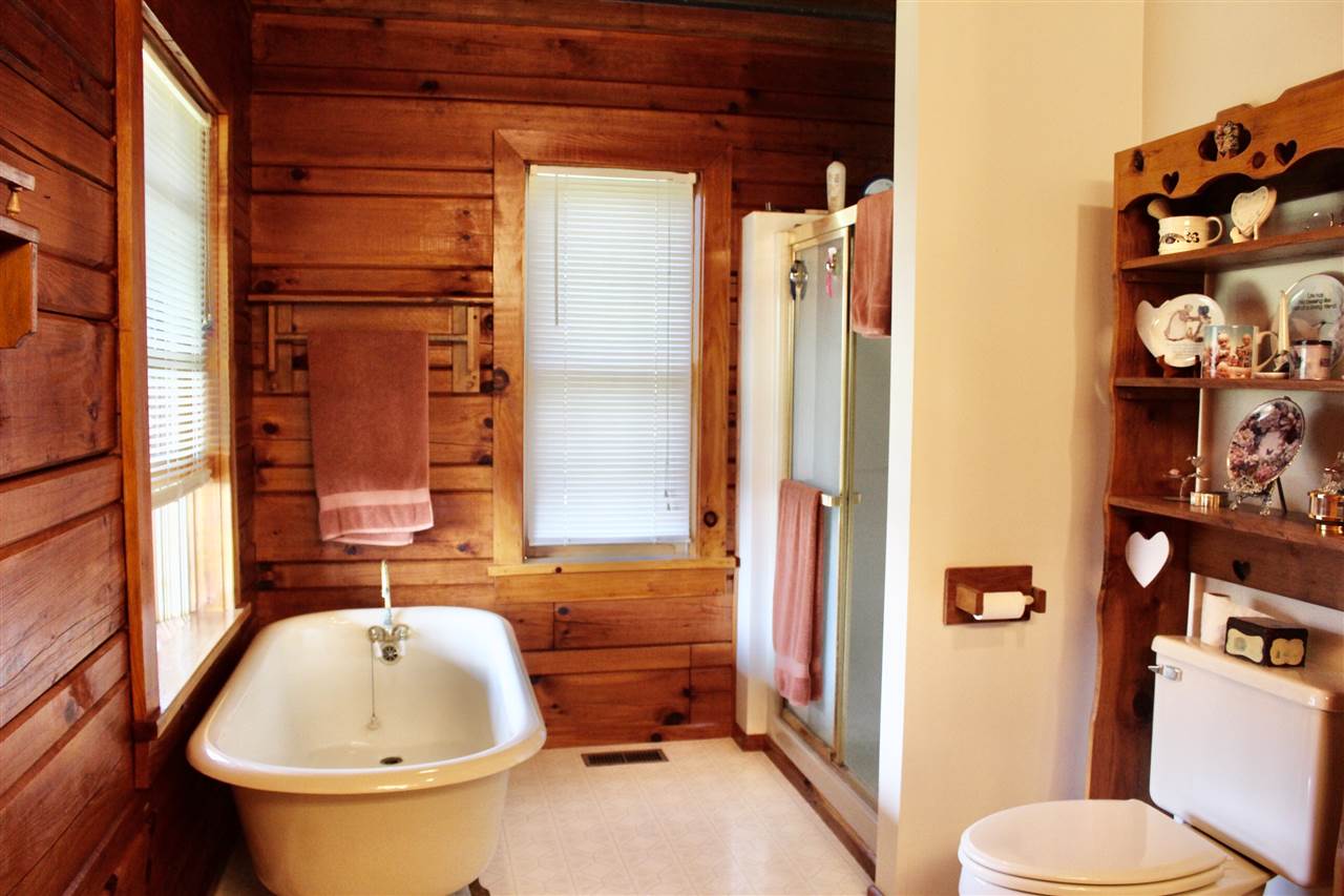 1185 Bunker Hill Road Mount Solon, VA 22843 - Photo 18 of 39 a bathroom with a tub and toilet