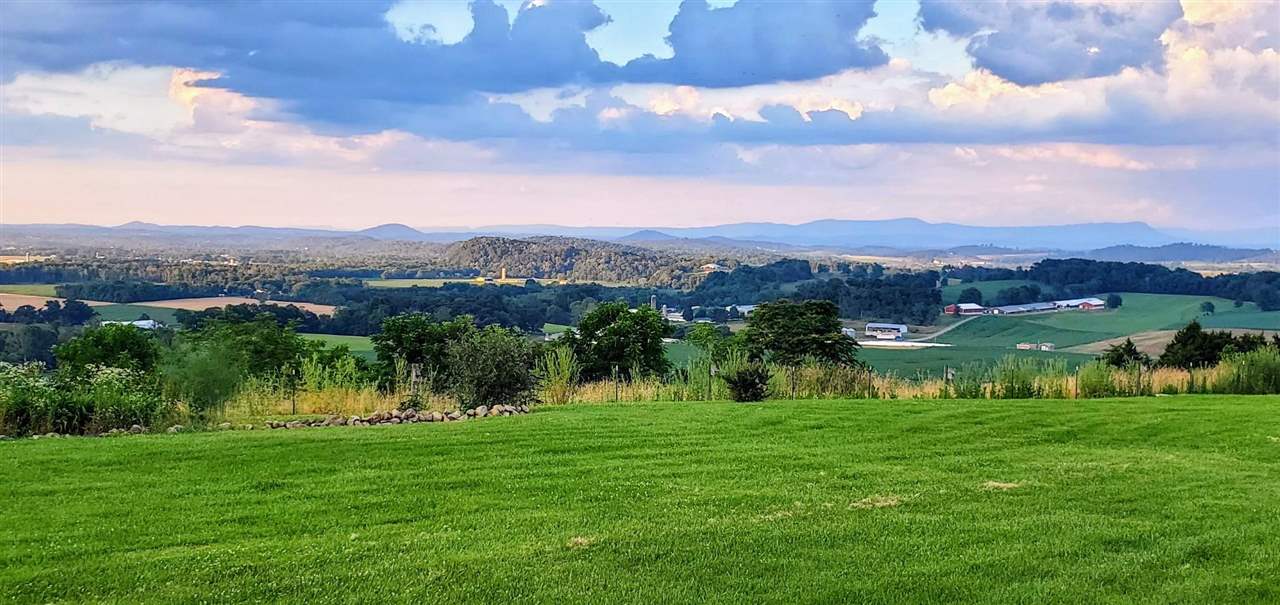 1185 Bunker Hill Road Mount Solon, VA 22843 - Photo 38 of 39 a view of a lake with a mountain in the background