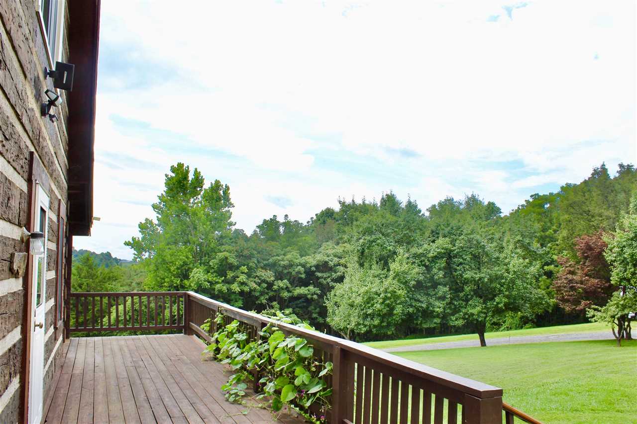 1185 Bunker Hill Road Mount Solon, VA 22843 - Photo 6 of 39 a view of a balcony with wooden floor & fence