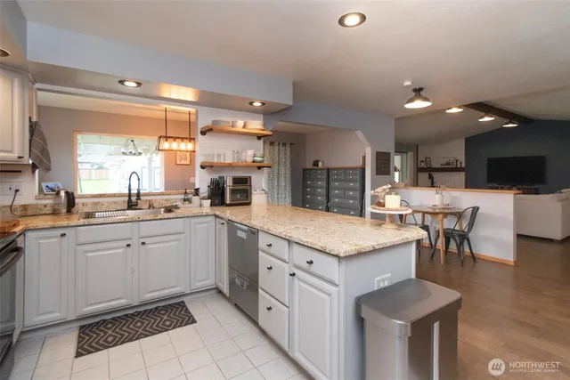 a kitchen with a sink and cabinets