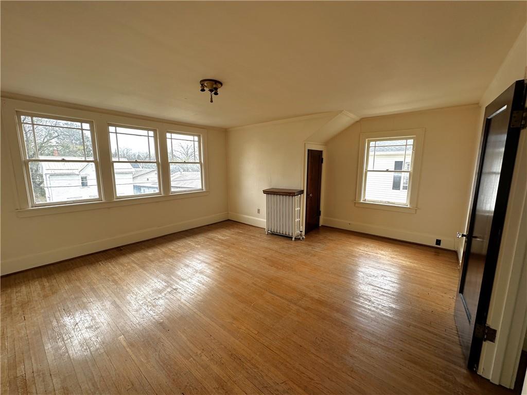 919 Oak Street Indiana, PA 15701 - Photo 13 of 27 a view of an empty room with wooden floor and a window