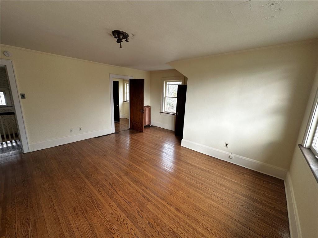 919 Oak Street Indiana, PA 15701 - Photo 16 of 27 a view of an empty room with wooden floor and a window