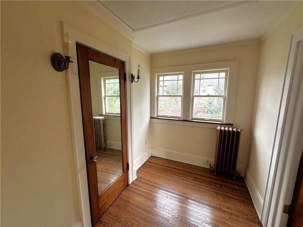 919 Oak Street Indiana, PA 15701 - Photo 17 of 27 an empty room with wooden floor and a window