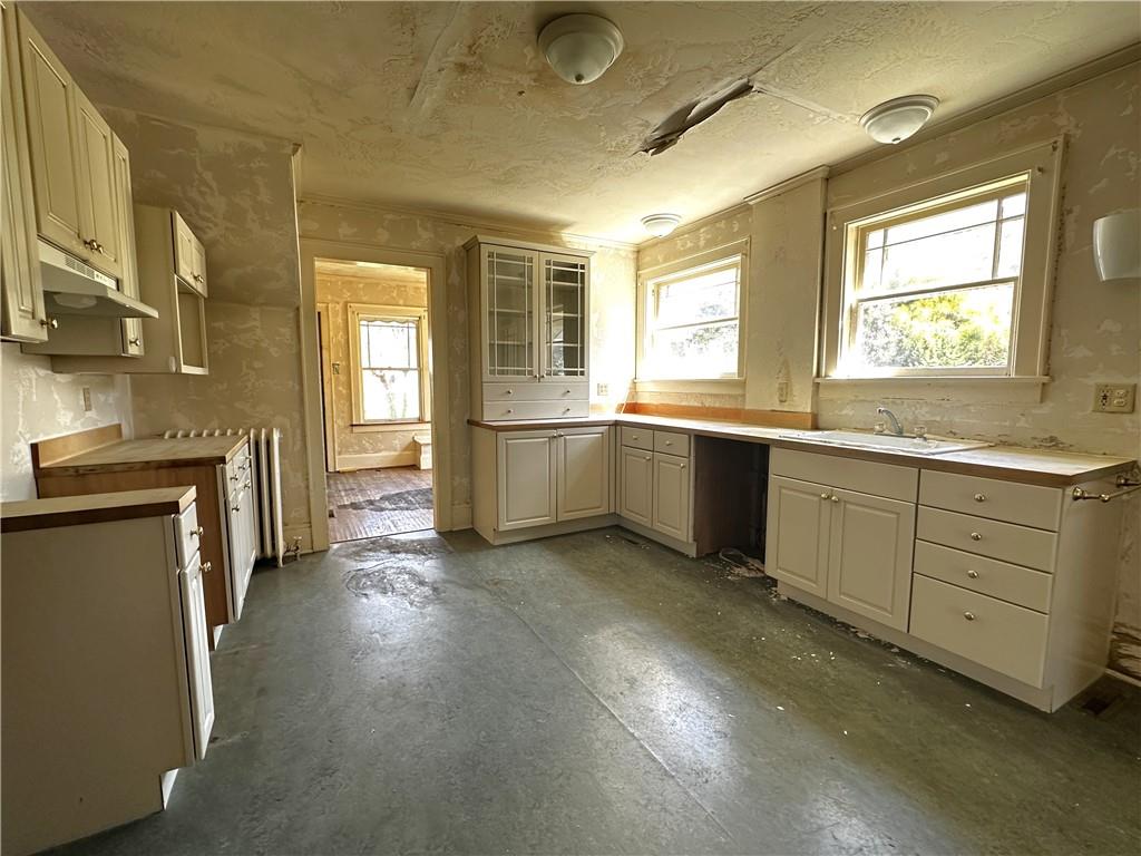919 Oak Street Indiana, PA 15701 - Photo 9 of 27 a view of a big room with wooden floor and windows