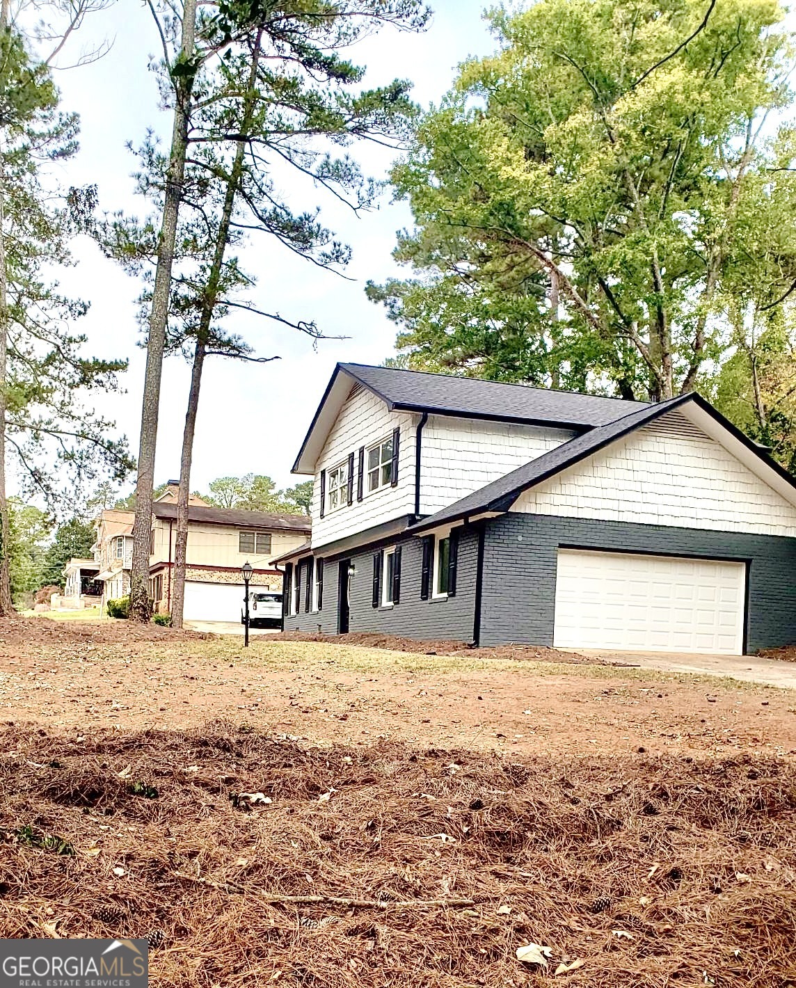 5058 Rock Springs Road Lithonia, GA 30038 - Photo 25 of 28 a house with trees in the background