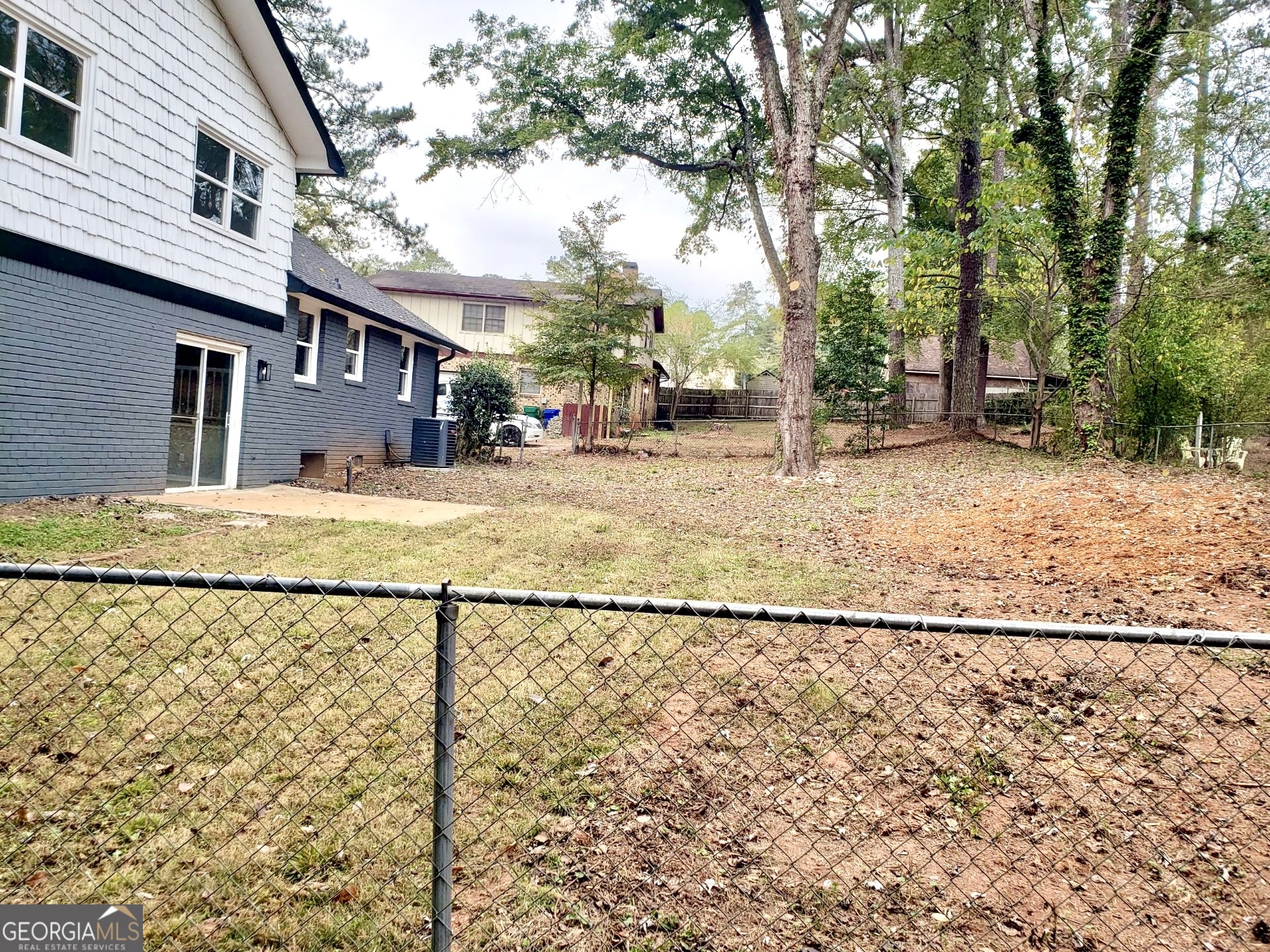 5058 Rock Springs Road Lithonia, GA 30038 - Photo 28 of 28 a street view along with residential houses