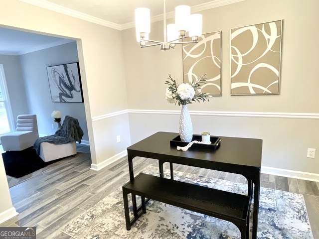 5058 Rock Springs Road Lithonia, GA 30038 - Photo 5 of 28 a view of a bedroom with furniture and wooden floor