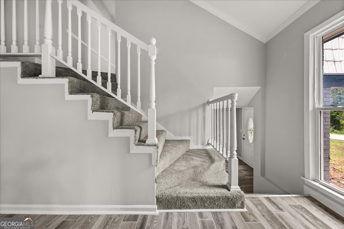 5058 Rock Springs Road Lithonia, GA 30038 - Photo 10 of 28 a view of entryway and hall with wooden floor