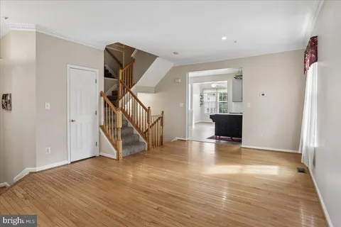 a view of an entryway with wooden floor