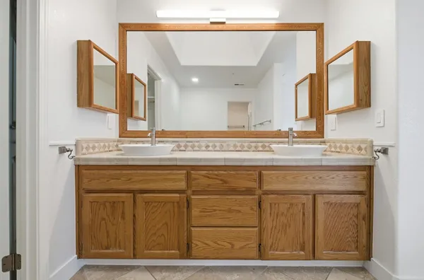 a spacious bathroom with a bathtub and shower