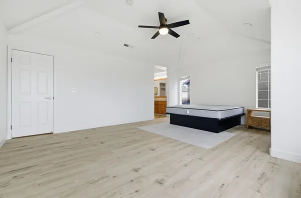 a bedroom with furniture and window