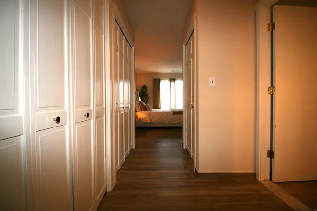 a view of a bedroom from a hallway