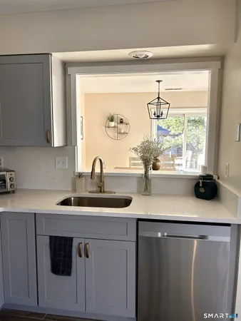 a kitchen with a sink and a window