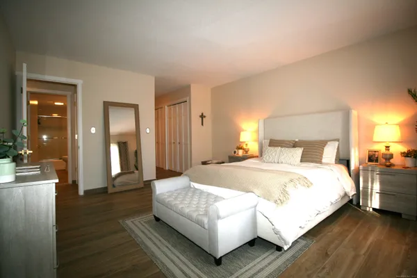 a bedroom with a bed and window