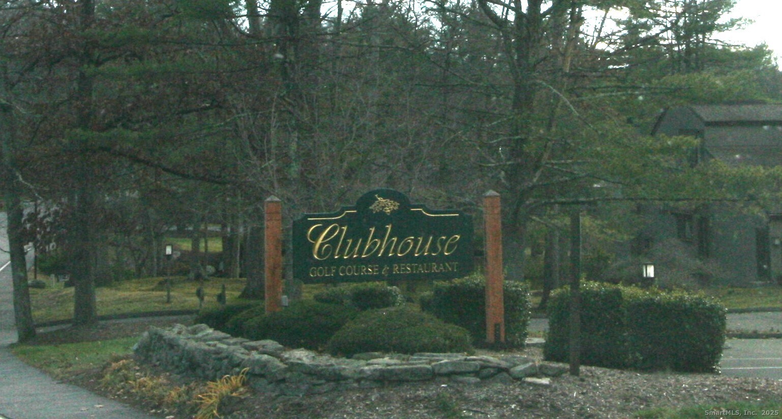 7 Twin Oak Court, Unit 7 Avon, CT 06001 - Photo 32 of 32 a sign that is sitting in front of a brick house