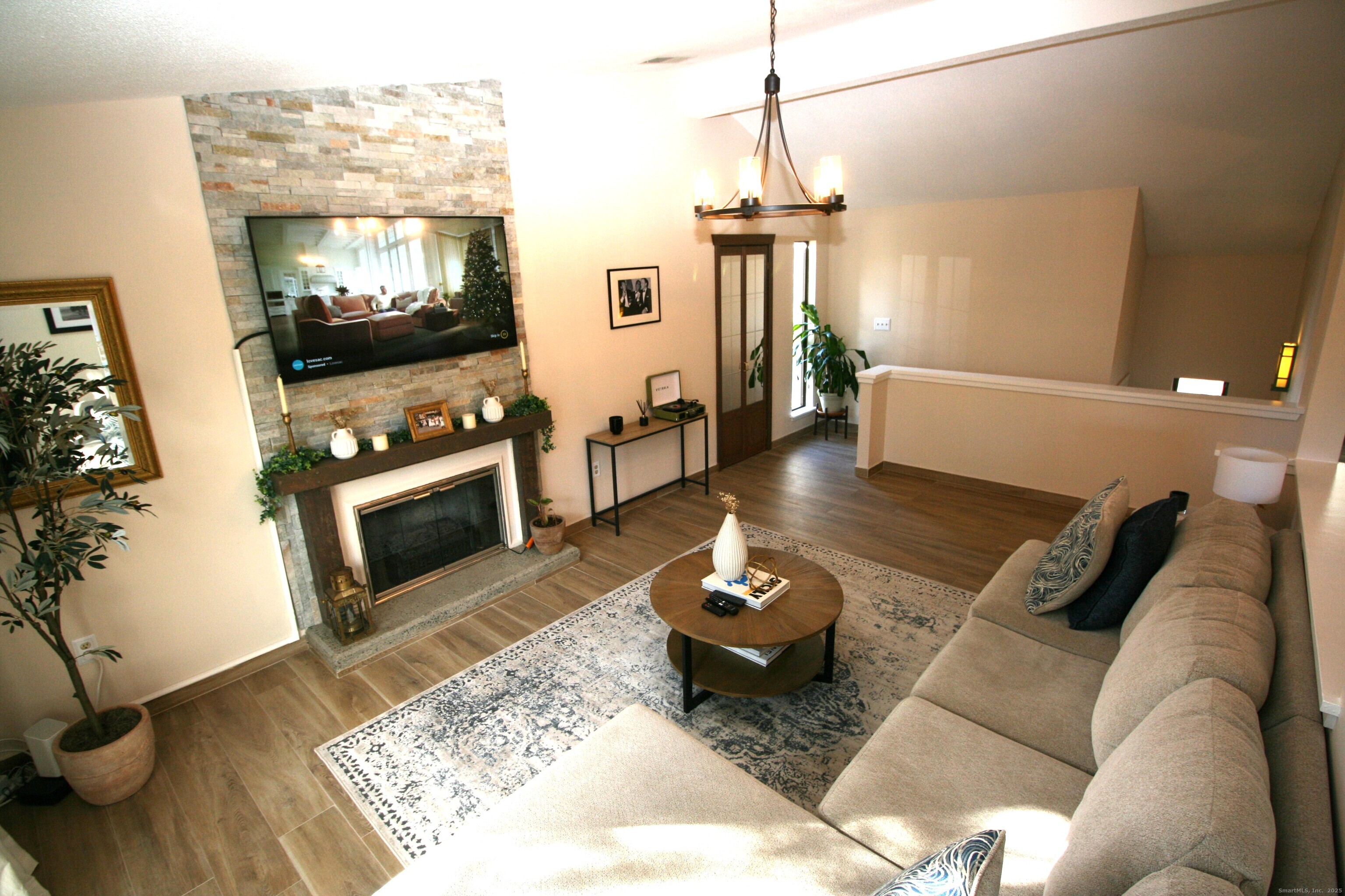 7 Twin Oak Court, Unit 7 Avon, CT 06001 - Photo 4 of 32 a living room with furniture and a flat screen tv