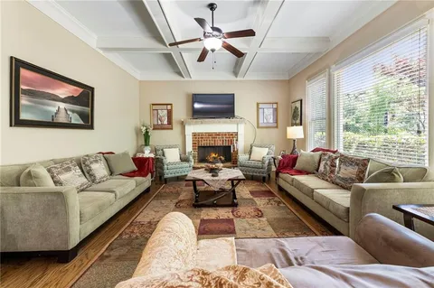 a large kitchen with stainless steel appliances granite countertop a refrigerator and stove