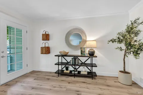 a view of a livingroom with furniture and a potted plant