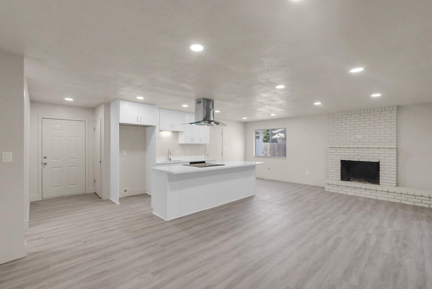 2832 Fowler Road Ceres, CA 95307 - Photo 3 of 28 a large kitchen with a lot of counter space and wooden floor