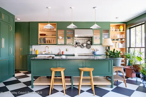 a kitchen with a table and chairs in it