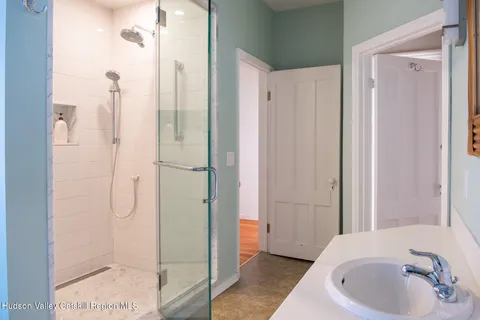 a bathroom with a bathtub and a shower