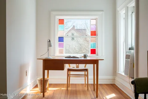 a room with a bench and a window