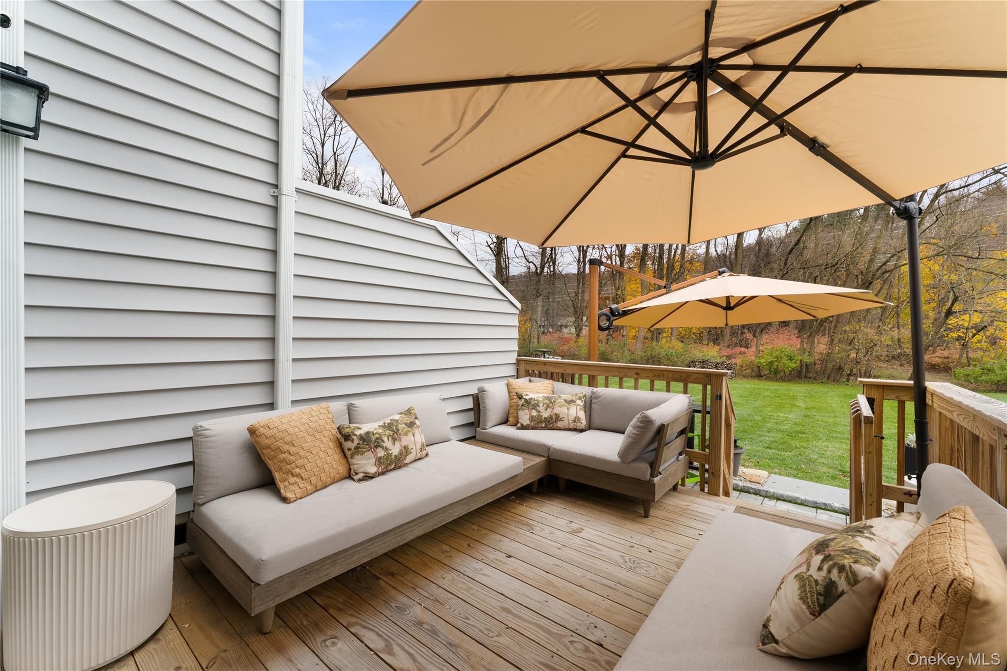 17 Ledgewood Commons Millwood, NY 10546 - Photo 15 of 22 a view of a patio with couches and table under an umbrella