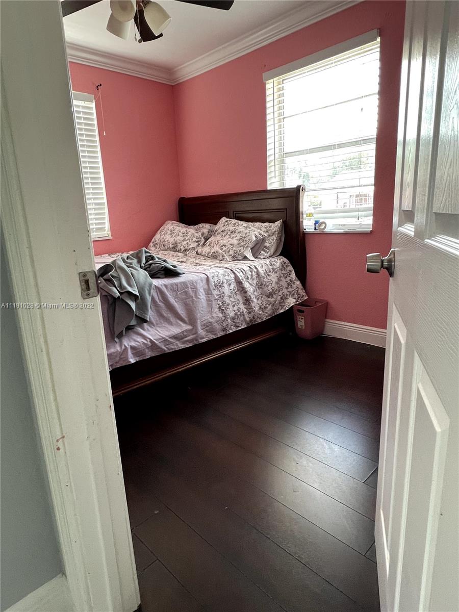 554 West 2nd Street Riviera Beach, FL 33404 - Photo 11 of 11 a bedroom with a bed and a window