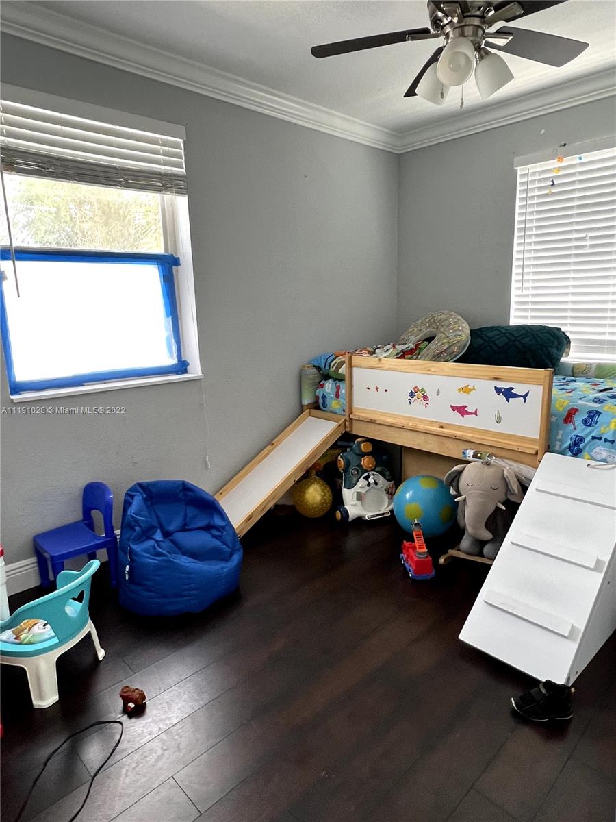 554 West 2nd Street Riviera Beach, FL 33404 - Photo 2 of 11 a kids room with toys and window
