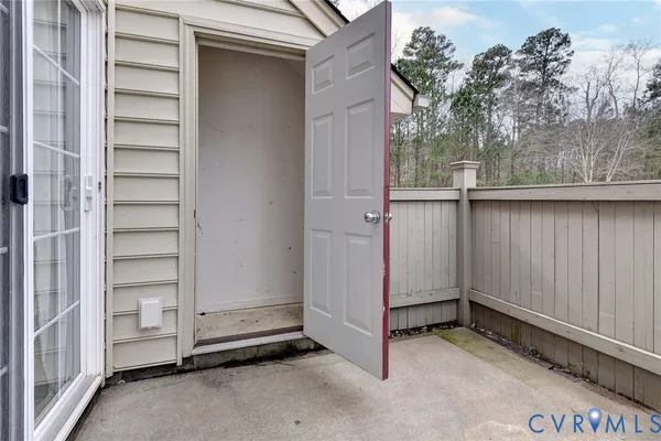 an empty room with a wooden door