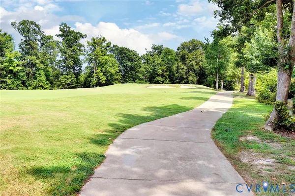 a view of a field with an trees