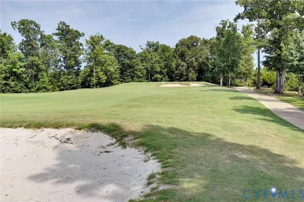 a view of outdoor space with seating and trees