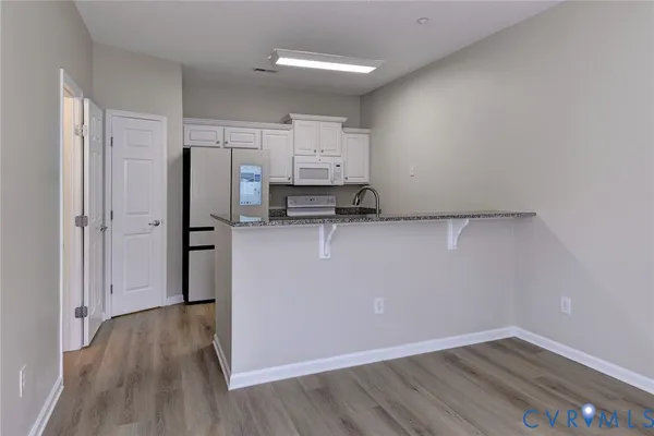 a view of a storage & utility room with wooden floor