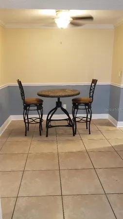 a patio with table and chairs
