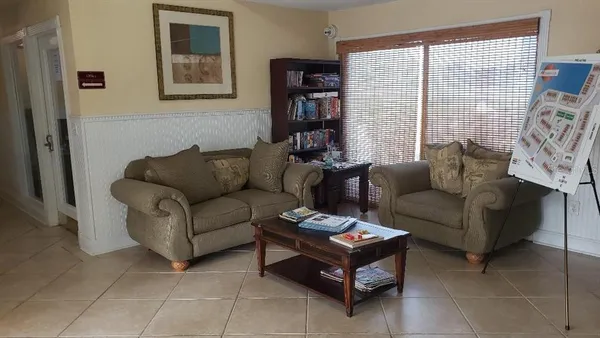a living room with furniture and a window