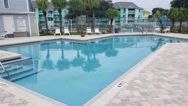 a view of a swimming pool with a patio