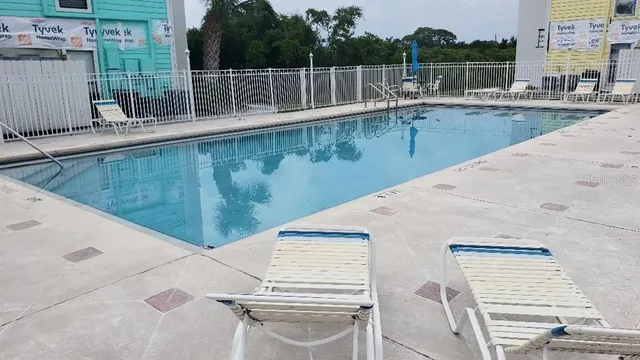 a view of a swimming pool with a patio