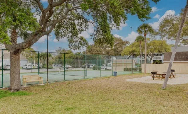 a view of a park with swings and slides
