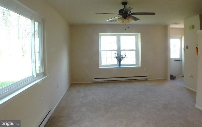 7024 Basswood Road Frederick, MD 21703 - Photo 2 of 12 a view of an empty room with a window