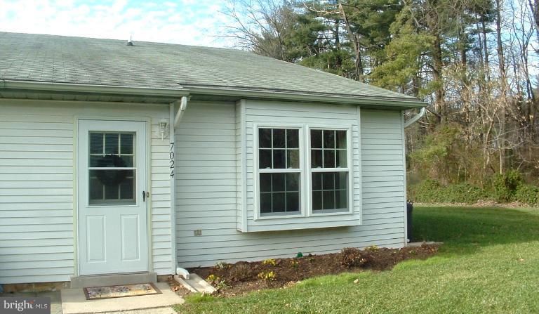 7024 Basswood Road Frederick, MD 21703 - Photo 12 of 12 a front view of a house with a yard
