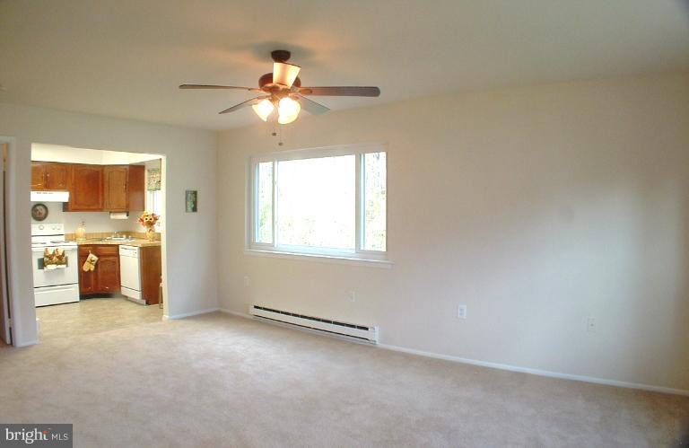 7024 Basswood Road Frederick, MD 21703 - Photo 5 of 12 an empty room with windows and fan