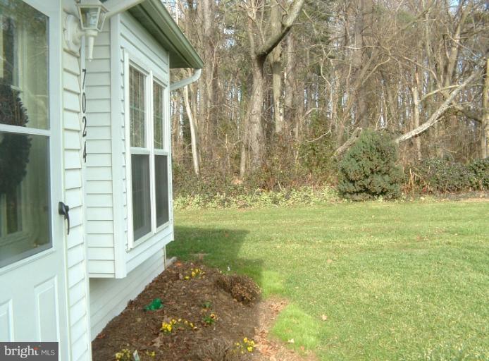 7024 Basswood Road Frederick, MD 21703 - Photo 7 of 12 a view of back yard of the house