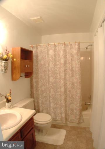 7024 Basswood Road Frederick, MD 21703 - Photo 8 of 12 a bathroom with a toilet and a sink