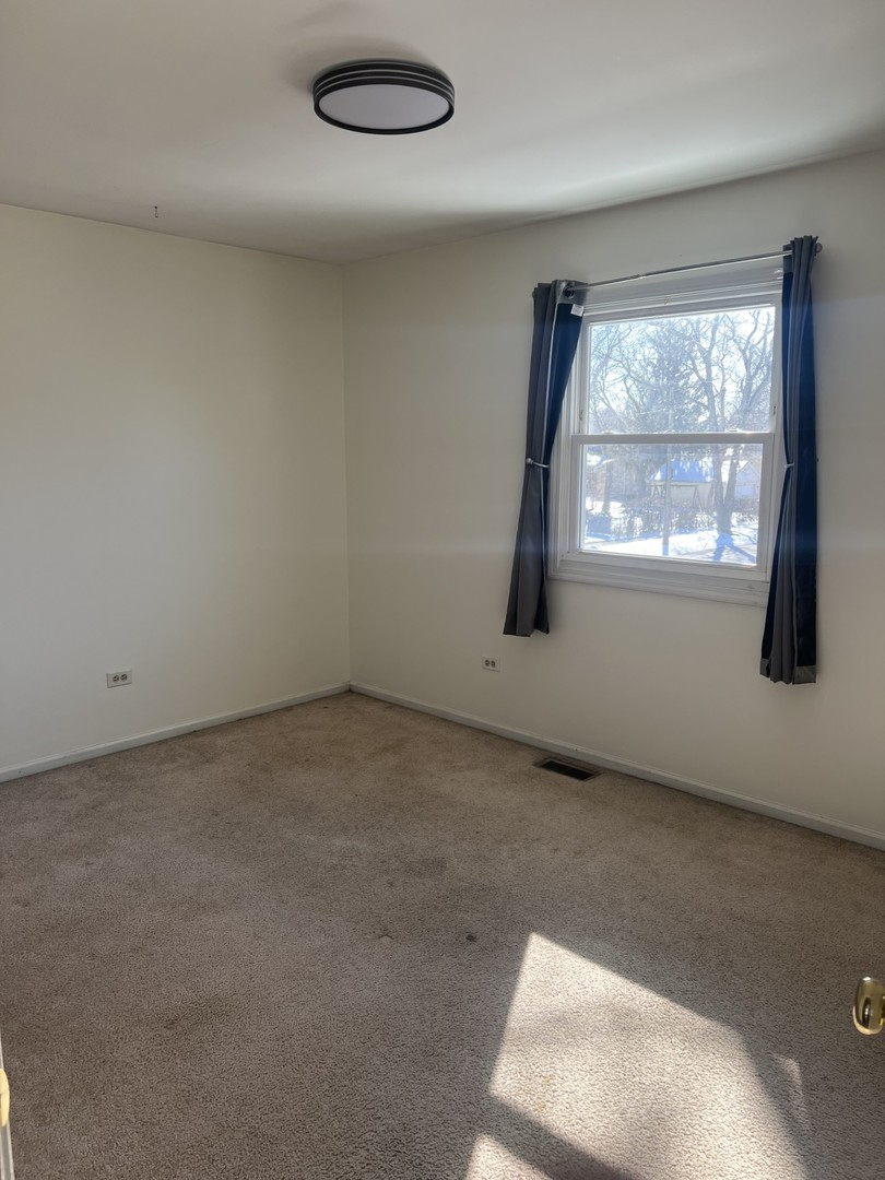 1707 Pine Road Homewood, IL 60430 - Photo 14 of 22 an empty room with a window