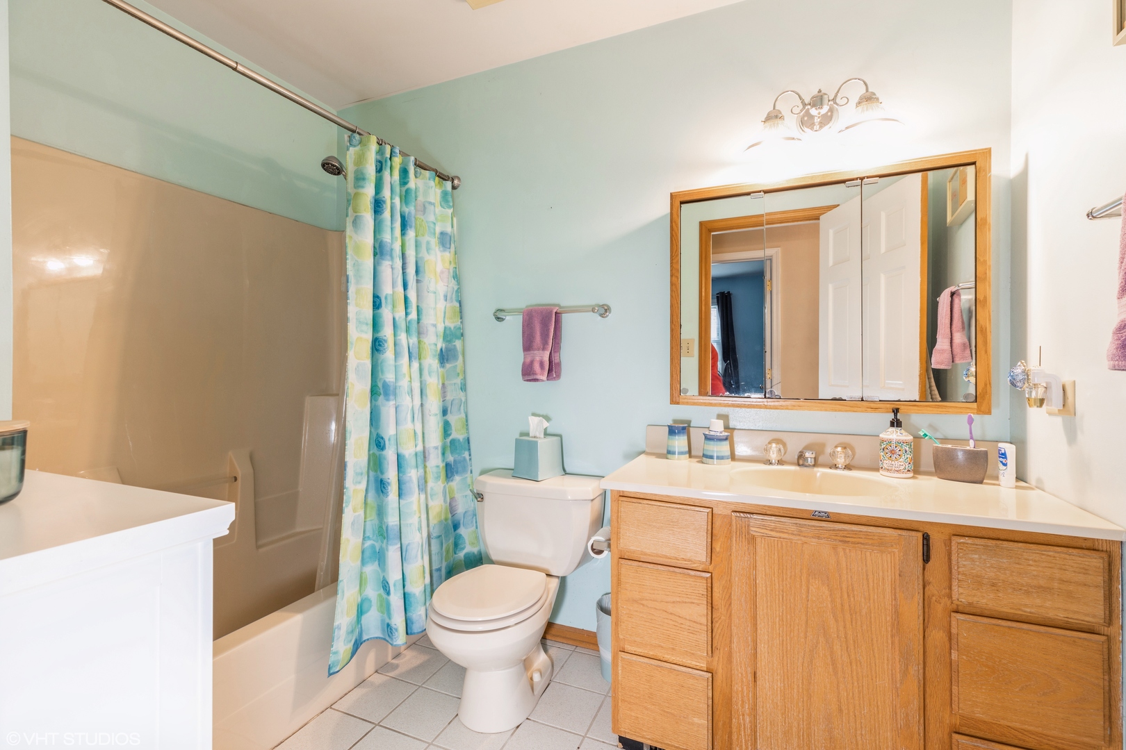 1707 Pine Road Homewood, IL 60430 - Photo 17 of 22 a bathroom with a sink a toilet and shower