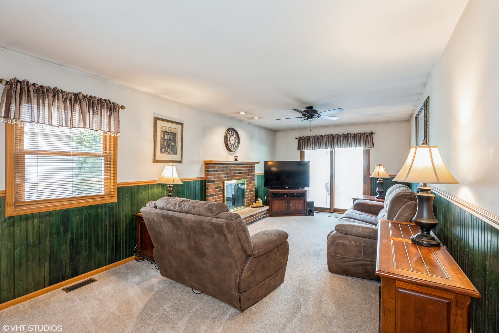 1707 Pine Road Homewood, IL 60430 - Photo 5 of 22 a living room with furniture a fireplace and a flat screen tv